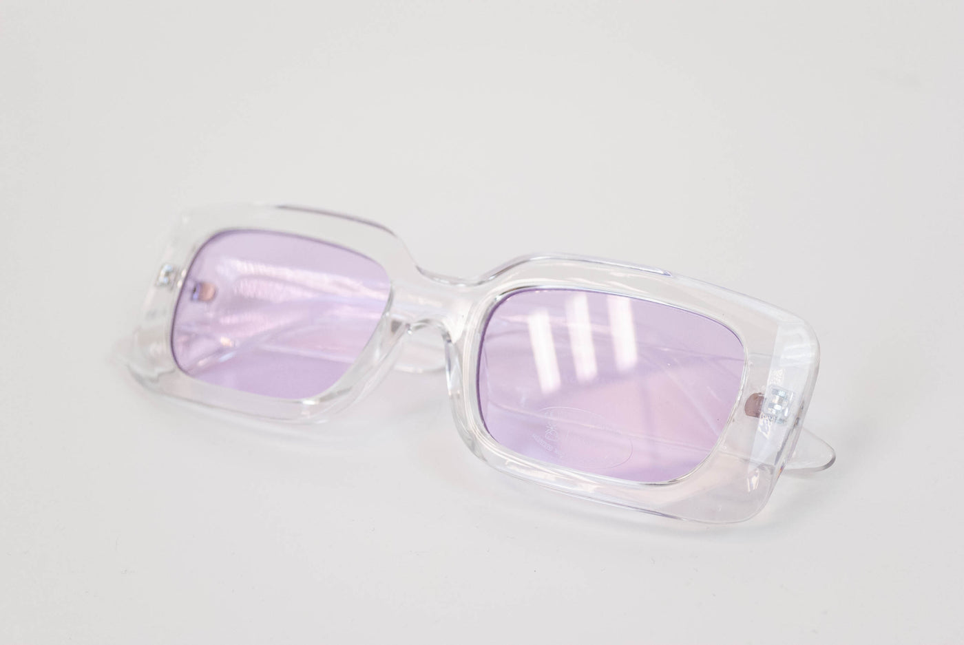 Gafas con lentes moradas y pasta transparente segunda mano –