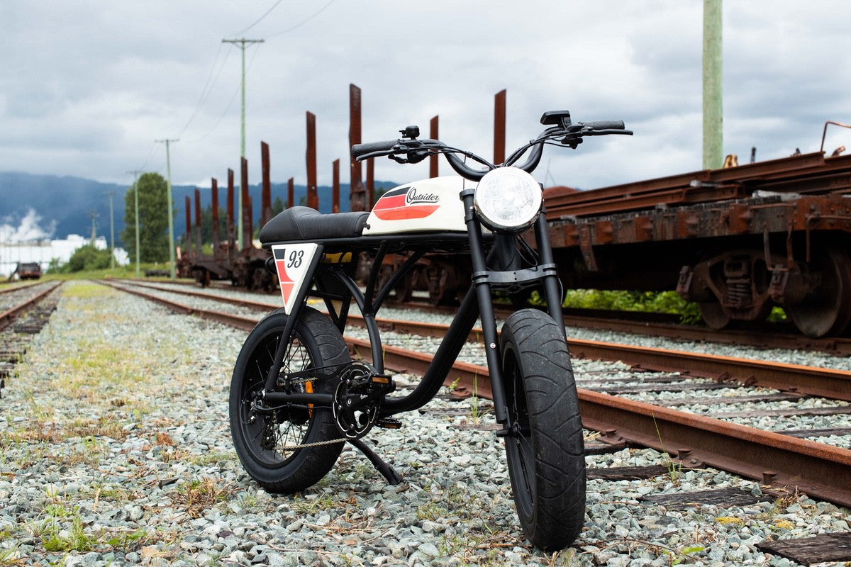 Michael Blast Outsider eBike with mini fat tires parked by train tracks