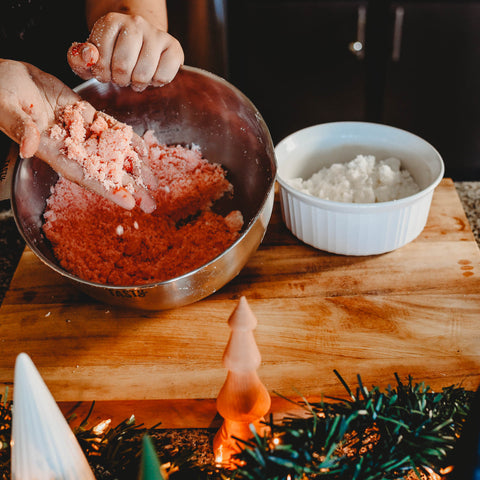 Mixing wet ingredients and color into kid safe diy bath bombs