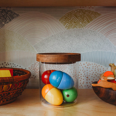 Haba Shakin Eggs on a toddler toy shelf. Early learning toys