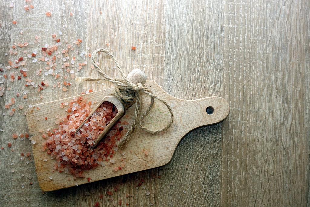 Pink Himalayan Salts on wooden table