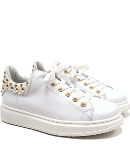 white sneakers with gold studs