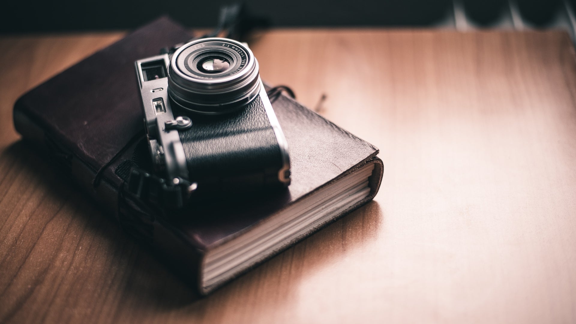 Film camera on a leather bound journal