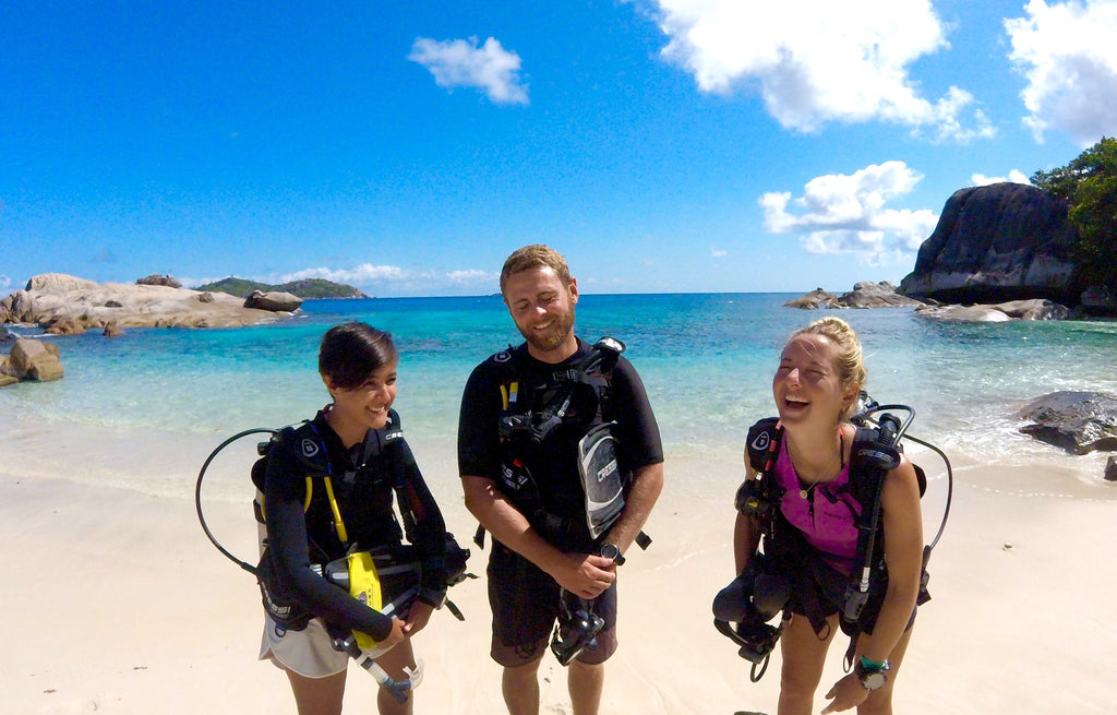 3 happy divers standing by the shore, P40 - founders