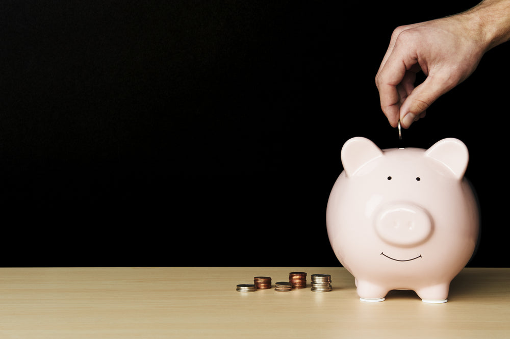 Piggy bank with coins scattered around it