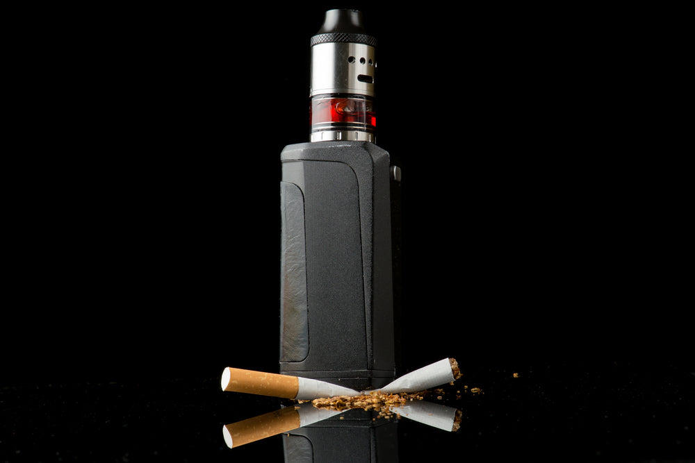 Vaping device over cigarette