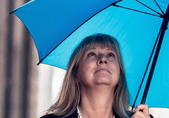 Eva under the umbrella thinking of art