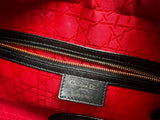 red jacquard pattern in the black lady bag