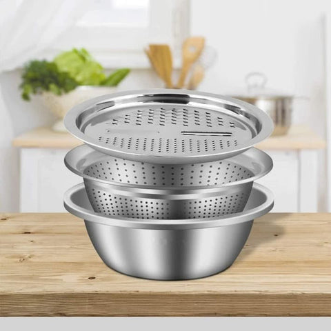 Multifunctional steel kitchen utensil for cutting grating sieving and cooking standing on a kitchen counter