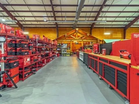 An aisle full of Milwaukee drills, tools, and tool boxes in our Dawsonville tool store.
