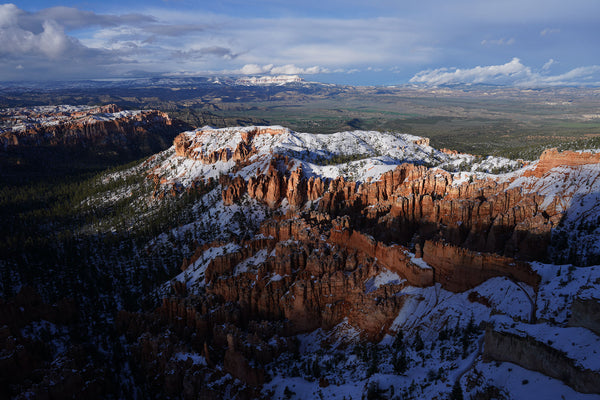 Aerial shot of a snow-capped mountain range.