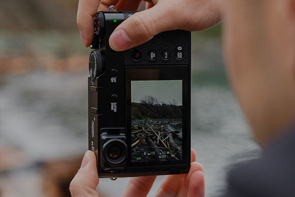 A photographer captures a vertical video.