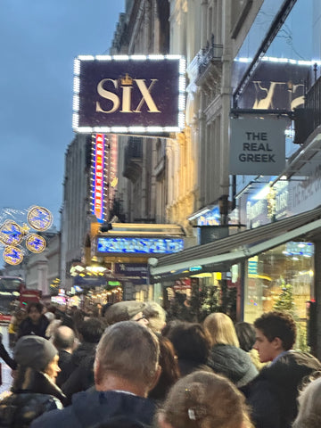 Six The Musical sign outside the theatre in London - as I waited in line