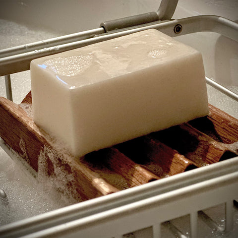 Royal Soap Cake on wooden soap holder in clawfoot bathtub