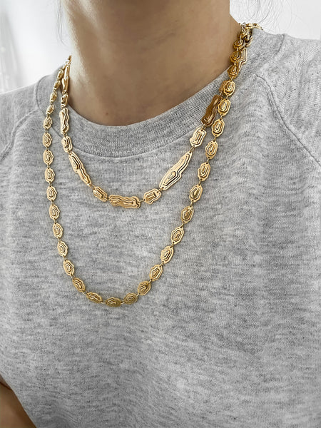 Jewellery stories by Kay Konecna | layered necklaces in gold vermeil with a grey hoodie. Shop online at www.kaykonecna.com