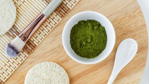 ground matcha powder in a white bowl