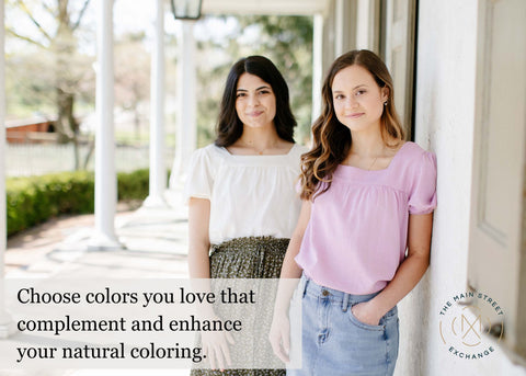 Two women standing on a sunny porch in uplifted casual outfits.