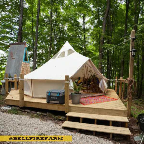 yurt tent on deck in woods