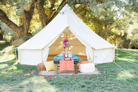 A white tents decorated with colorful flowers