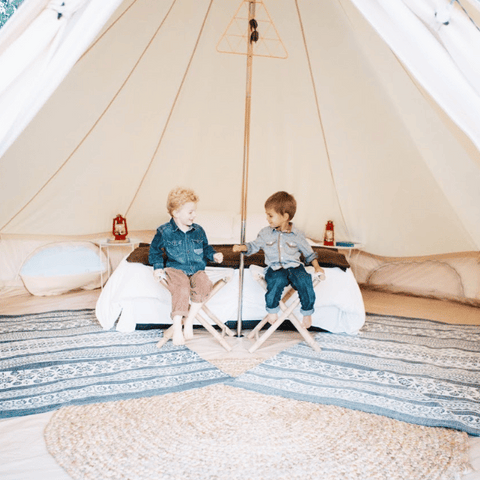 kids inside a canvas family camping tent