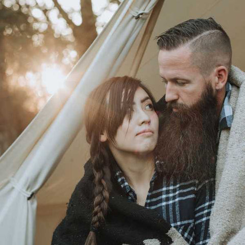 couple in front of tent on valentines day