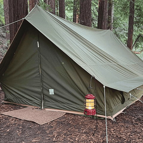 canvas a-frame tent in the woods