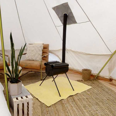 wood burning stove inside of a camping tent