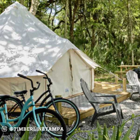 timberline tampa glamping tent with bikes and chairs