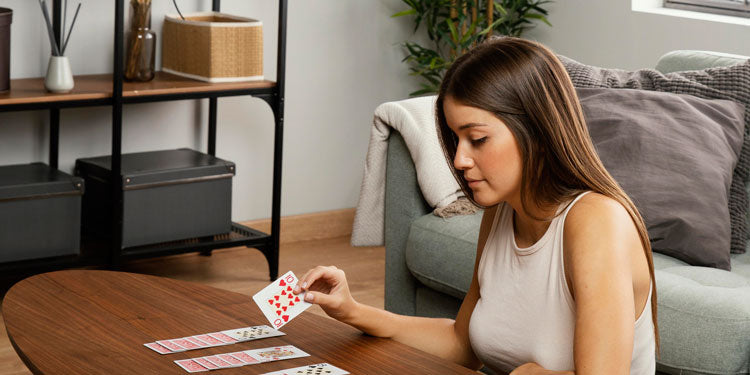 woman playing a single player card game