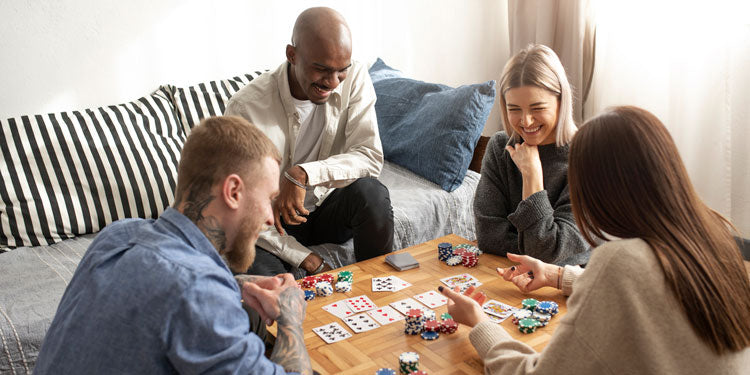 a group of friends having a board game night and playing cards, all are happy and having fun