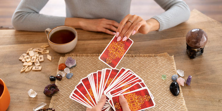 two people playing Chineese type playing cards