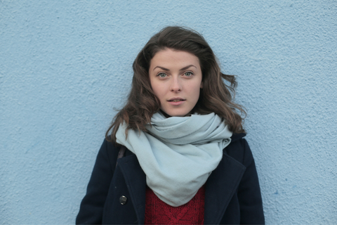 Woman in Black Trench Coat and White Scarf