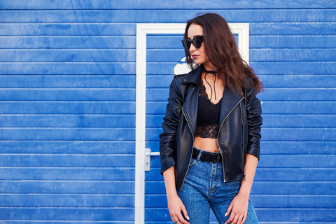 woman with brown hair wearing leather jacket