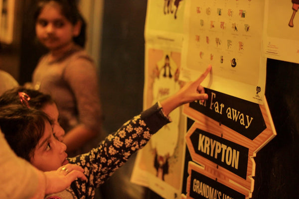 childrens pointing to poster board