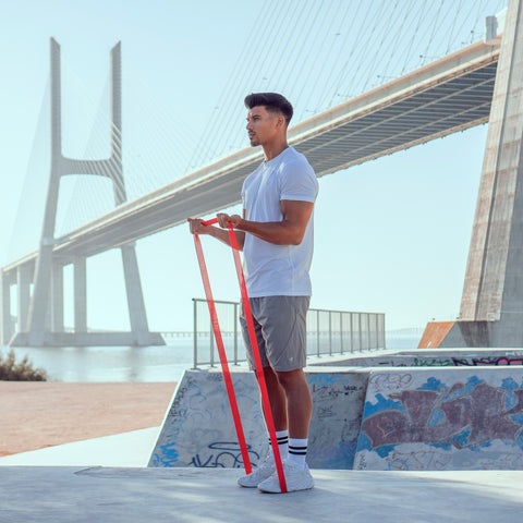 Man training with pull-up band