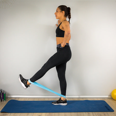 Theraband leg extensions while standing Target position
