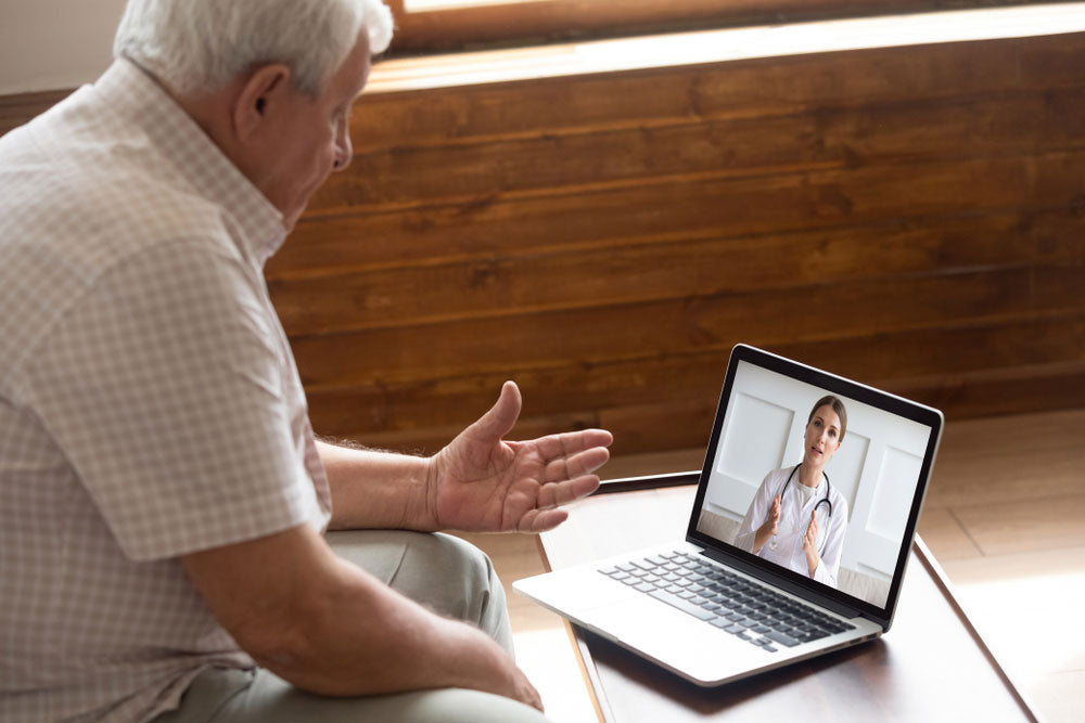 man on video call with his doctor