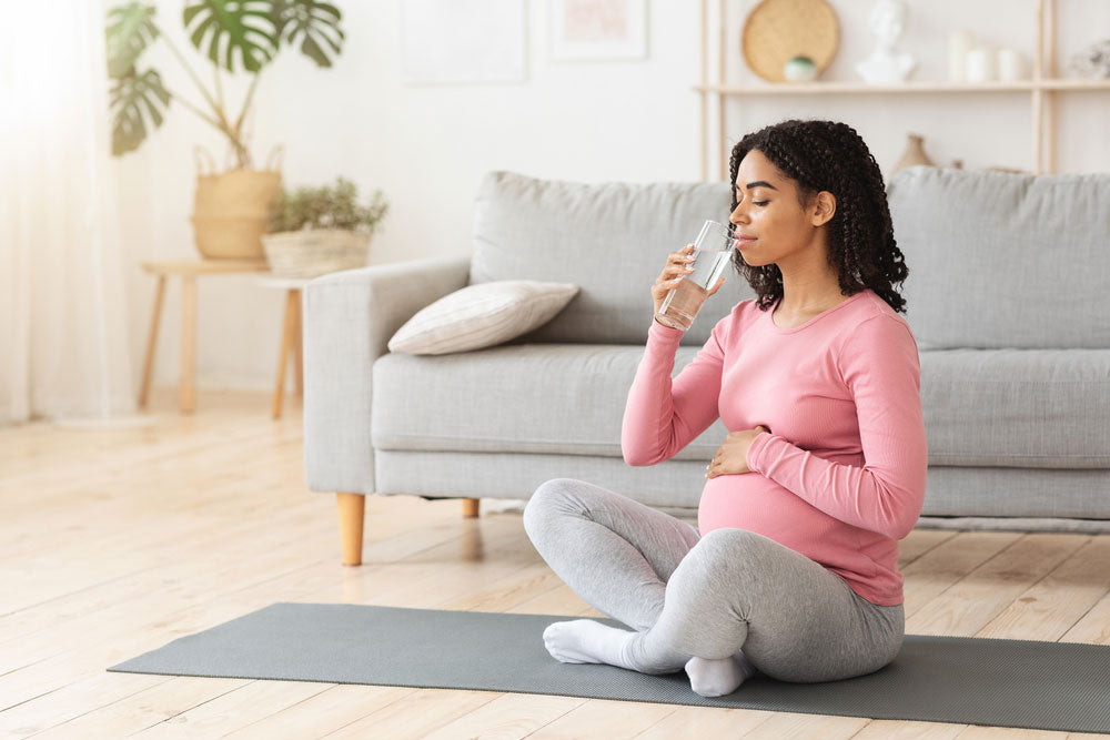 pregnant woman drinking water