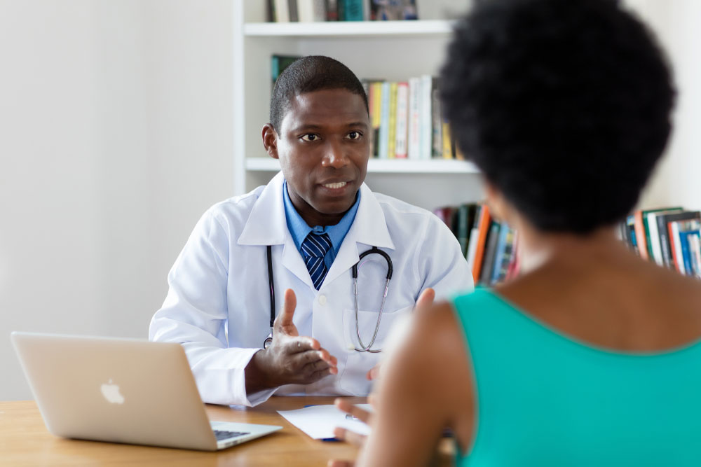 woman speaking with doctor