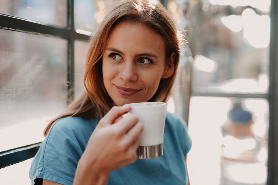 Woman holding a coffee cup