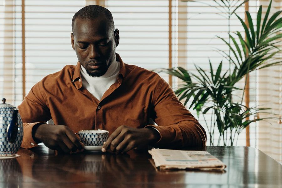 Man contemplating drinking his CBD tea