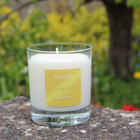 Inspire Candle from The Positive Collection in garden