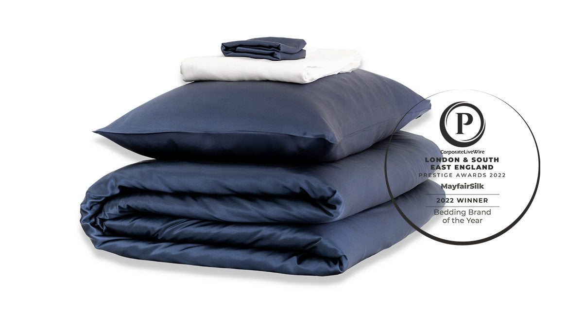 Mayfairsilk wins best bedding brand of the year 2022 by prestige awards - midnight blue silk duvet set pictured