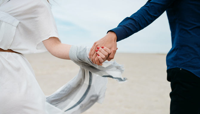 couple celebrating their anniversary holding hands