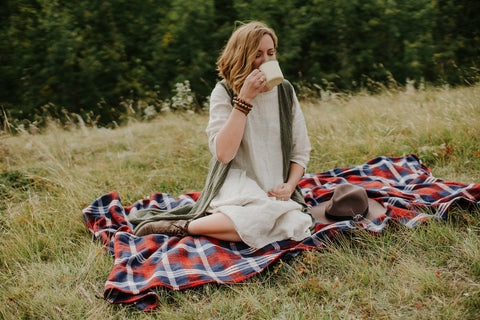 woman drinking hot tea outside