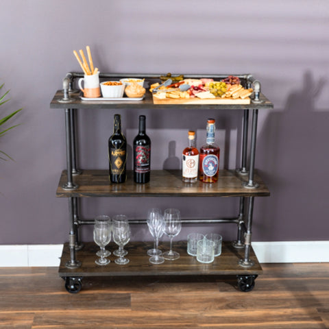 Image of an industrial pipe bar cart beautifully arranged with a variety of spirits, wine bottles, and glasses, ready for Mother's Day celebrations.