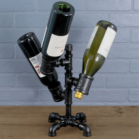 Creative PIPE DECOR® wine holder displaying three wine bottles, adding an innovative and stylish touch to any kitchen or dining area.