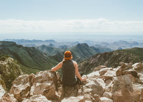 Amanda sitting at the top of Emory Peak looking out at the Chihuahuan Desert.