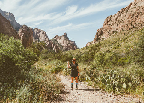 Amanda standing at the entrance to the Window Trail in Big Bend National Park.