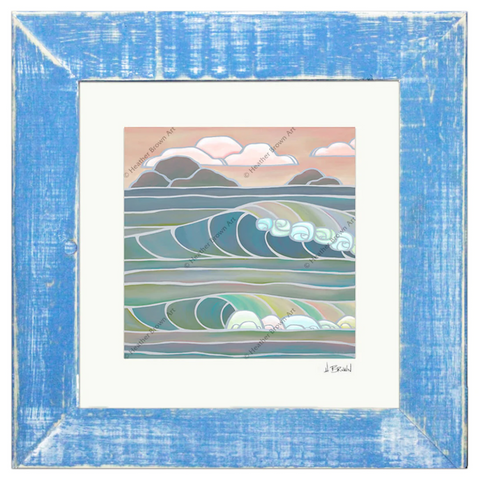 framed art print by heather brown with pastel waves breaking on the shore with two islands in the sea